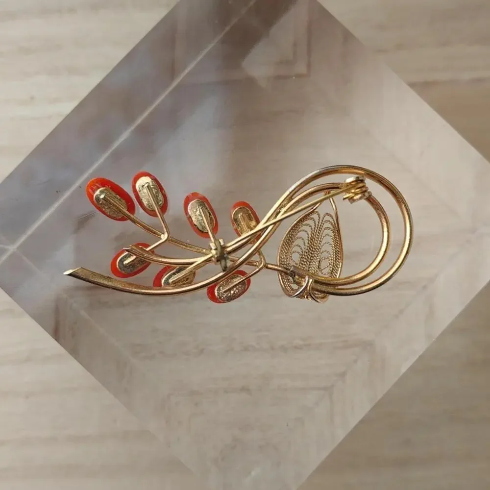 Vintage dark coral and gold tone floral spiral brooch